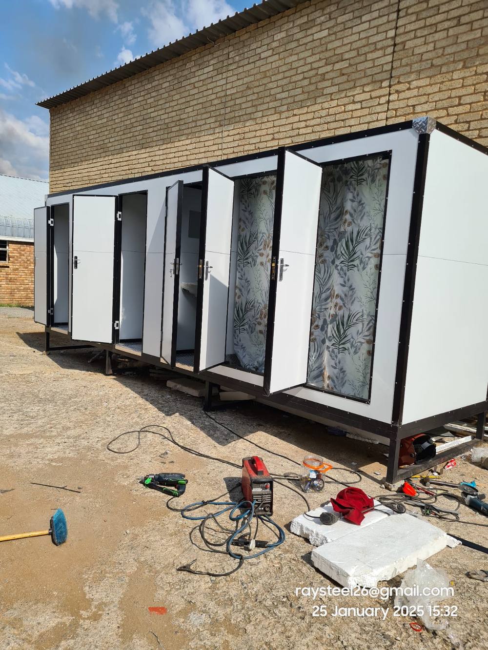 Mobile toilet block with open doors